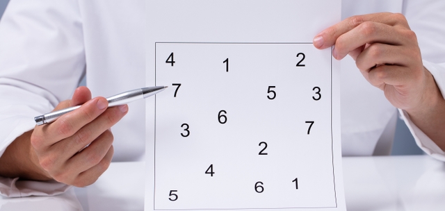 Clinician showing sequencing subtest: random numbers arranged on a page.